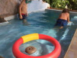 Kids playing in rock-spa pool. Les enfants,riock-spa pool.Roseharrycove,Seychelles 